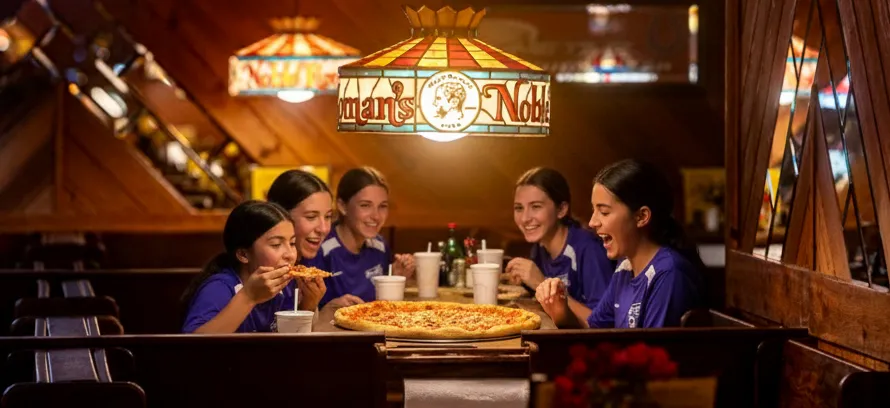 Ben Davis Soccer Club Enjoying a Noble Roman's Hand-Tossed Pizza
